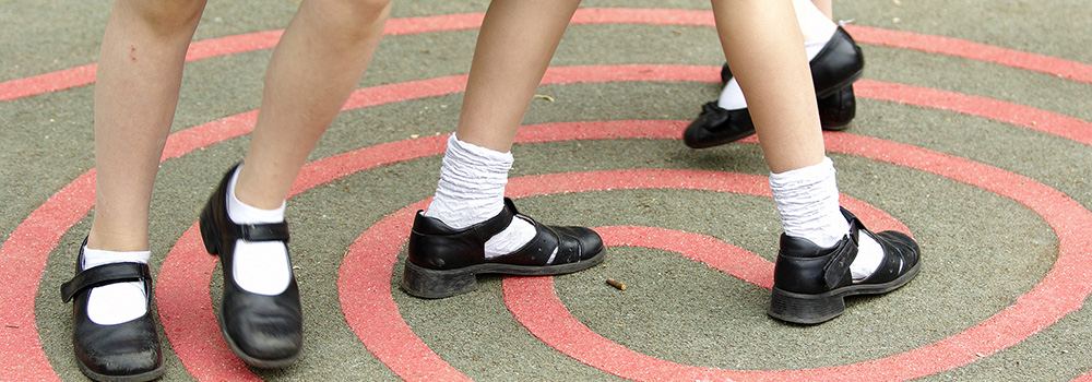 Feet of children in a playground