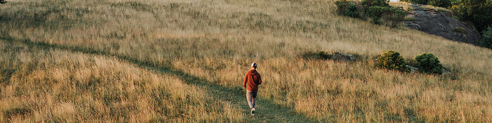 Person walking across a field